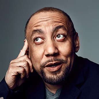 Headshot of Kylar Broadus, leaning against his hand and looking upward. Photo by Danielle Levitt for OUT Magazine