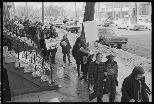 Download the full-sized image of Marsha P. Johnson Walking Down Street With Sign at Gay Rights Demonstration