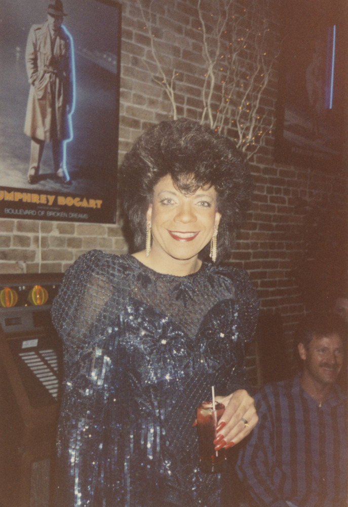 Download the full-sized image of Photograph of a Person in a Bar Wearing a Blue Dress