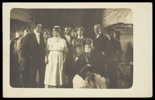 Download the full-sized image of Actors performing at a prisoner of war camp in Osnabrück. Photographic postcard. 1916.