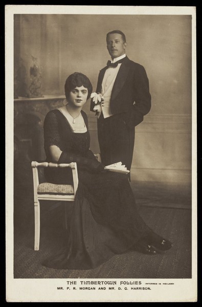 Download the full-sized image of Two actors performing for "The Timbertown Follies" at a prisoner of war camp in Groningen. Photographic postcard, 191-.