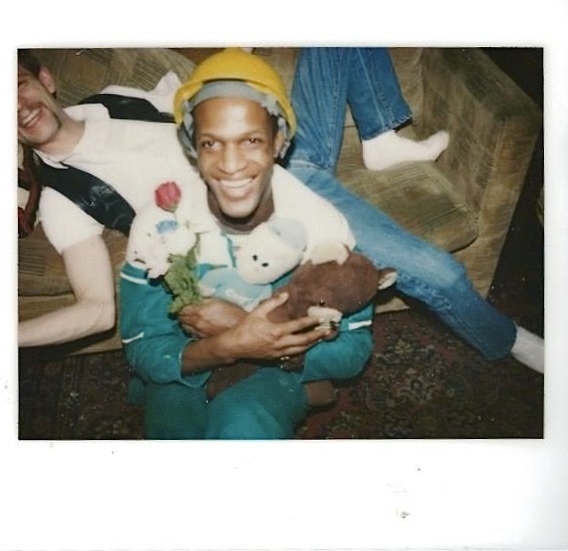 Download the full-sized image of A Photograph of Marsha P. Johnson Wearing a Construciton Hat and Holding Stuffed Animals