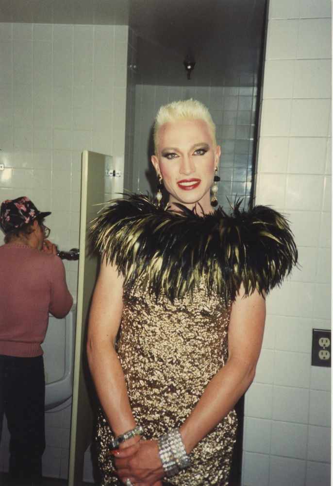 Download the full-sized image of Photograph of Person in Gold Feathered Dress
